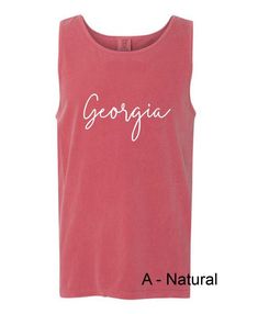 a pink tank top with the word georgia written in white ink on it's chest