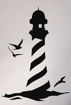 a lighthouse with seagulls flying around it on a white wall in a room