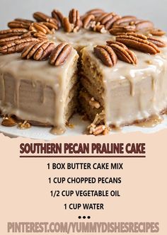 a cake with frosting and pecans on top