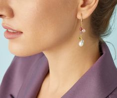 Elegant and sophisticated, these drop earrings feature a cascade of colorful heart-cut gemstones alternating with multicolored freshwater pearls. They are further embellished with a hook of brilliant-cut diamonds.