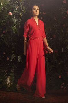 Red jumpsuit with bead, thread embroidery in floral pattern on neckline and sleeve hem. Paired with embroidered belt. - Aza Fashions Fitted Embroidered Jumpsuit For Festive Occasions, Embroidered Fitted Jumpsuits And Rompers For Festive Occasions, Festive Embroidered Fitted Jumpsuits And Rompers, Festive Floor-length Jumpsuits And Rompers For Summer, Elegant Summer Festive Jumpsuits And Rompers, Jumpsuit With Belt, Embroidered Jumpsuit, Embroidered Belt, Belt Women