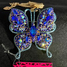 New Betsey Johnson Rhinestone Embellished Blue Butterfly Necklace Betsey Johnson Chain Length: 27.5" Betsey Johnson Medal Heart Hang Tag Betsey Johnson Is An American Fashion Designer Best Known For Her Feminine And Whimsical Designs. Many Of Her Designs Are Considered "Over The Top" And Embellished. She Also Is Known For Doing A Cartwheel At The End Of Her Fashion Shows. From Wikipedia Please Email Me For Additional Photos, Details, Or Questions Many Blessings Shella Kate Blue Rhinestone Necklaces For Evening, Blue Rhinestone Necklace For Evening, Blue Party Necklace With Bling, Blue Jeweled Rhinestone Costume Necklace, Blue Crystal Embellished Jewelry Gift, Blue Crystal Rhinestone Necklace For Party, Blue Crystal Embellished Jewelry For Gift, Blue Crystal Embellished Jewelry For Party, Blue Rhinestone Necklace For Party