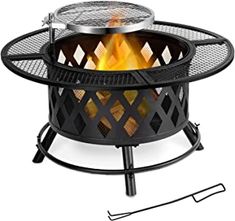 an outdoor fire pit is shown with the lid open and it's grill on top