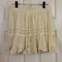 Dainty Beige vintage looking skirt NWT New with tags. Beige color with an under layer. Size medium. Forever 21 Skirts Beige Skirt With Lace Trim For Spring, Beige Lace Trim Skirt For Spring, Cream Flared Skirt For Summer, Beige Bottoms With Lace Trim Flowy Design, Cream Ruffled Mini Skirt For Summer, Spring Bohemian Short Mini Skirt, Summer Beige Skirt With Lace Trim, Cream Lined Skirt For Summer, Summer Mini Skirt With Lace Trim