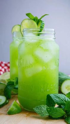 two mason jars filled with cucumber and limeade