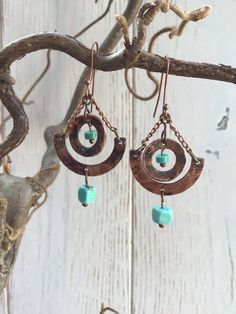 Hammered copper washers with copper wire, turquoise beads and copper chain. Rust Copper Dangle Earrings, Rust Copper Dangle Jewelry, Rust Colored Copper Dangle Jewelry, Rust-colored Copper Dangle Jewelry, Turquoise Copper Dangle Jewelry, Copper Dangle Earrings With Patina, Copper Dangle Jewelry With Patina, Turquoise Wire Wrapped Copper Earrings, Bohemian Jewelry In Copper Wire With Patina