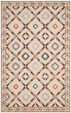 an orange, white and black rug with geometric designs on the bottom half of it