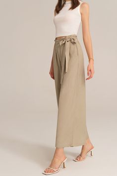 Experience the perfect blend of comfort and style with this casual elastic waist wide leg pants. This pants are designed for versatility and effortless elegance, making them a must-have for any casual occasion. Embrace a relaxed and chic look that is both comfortable and fashion-forward.Material : 75%Viscose+25%LinenElasticity : NoneSku : CL2814S24*Package : 1*PantsCare instructions:Do Not Bleach.Separate dark colors.Iron Low Heat. Versatile Ankle-length Wide Leg Pants, Chic Beige Wide-leg Culottes, Relaxed Fit Wide Leg Pants In Khaki, Khaki Wide Leg Cargo Pants, Versatile Beige High-waisted Wide Leg Pants, Versatile High-waisted Relaxed Fit Culottes, Versatile High-waisted Culottes With Relaxed Fit, Versatile Ankle-length Harem Pants, Elegant Wide Leg Pants With Tie Waist For Spring