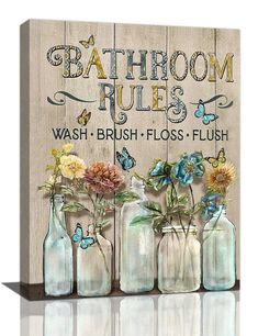 bathroom rules painted on wood with flowers in glass vases and butterflies around the jars