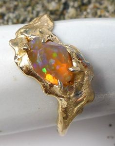 The Salt Marsh Shapeshifter Ring features an Ethiopian Opal, nestled a solid 14K gold band. Heirloom Gold Opal Ring With Polished Finish, Unique Yellow Gold Opal Ring For Anniversary, Unique Yellow Gold Opal Ring With Polished Finish, Unique 14k Gold Hallmarked Opal Ring, 14k Gold Hallmarked Opal Ring, Unique Hallmarked 14k Gold Opal Ring, Unique Hallmarked Opal Ring In 14k Gold, Collectible Opal Ring In 14k Gold, Unique Gold Opal Ring In 14k