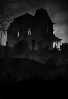 the silhouette of a man standing in front of a creepy house