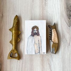 a drawing of jesus is next to a pair of scissors and a corkscrew