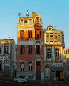 an old building with many windows and balconies on the top of it's roof