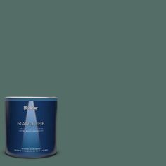 a can of marquee paint on a green background