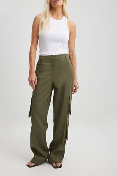 These cargo pants feature a straight leg and belt loops. They have a four-pocket design and double flap pockets on each leg. Our cargo pants feature a zipper, hook and button closure. Cargo Pants Green, Pants Green, Cargo Trousers, Lingerie Sleepwear, Khaki Green, Na Kd, Office Wear, Trouser Jeans, Swim Shorts