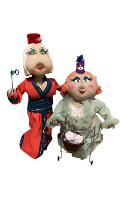 an image of two puppets that look like they are riding on top of each other