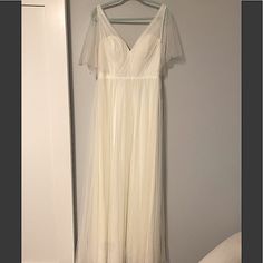 Bought For Wedding That Never Attended. Never Tried On, Never Altered, Tags Still Attached! A-Line Shape With Structured Bodice Tulle Cap “Sleeves” Color: White Pearl Material: Tulle Size: 12 Tall (5’8 And Above)- 51 Inches Waist To Hem Tulle V-neck Bridesmaid Dress For Wedding, Tulle Maxi Dress With Fitted Bodice For Wedding, Wedding Maxi Dress With Fitted Tulle Bodice, Tulle Maxi Dress For Wedding, Wedding Maxi Dress With Sweetheart Neckline In Tulle, White Tulle Maxi Dress For Wedding, White Tulle Bridesmaid Evening Dress, Elegant Tulle Dress For Bridal Shower, Floor-length Tulle Dress For Bride