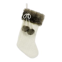 a white christmas stocking with faux fur trimmings and a pair of socks hanging from the side