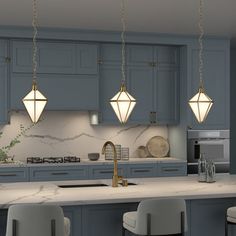 a kitchen with blue cabinets and marble counter tops