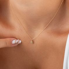 This minimal gold daisy necklace is perfect for everyday wear. This minimalist flower pendant is even more striking with the CZ diamond detail in the center. Available in yellow or rose gold. It is also sent with our free express shipping like all our products. NECKLACE DETAILS * Material:14 carat solid gold * Weight: 1.05 grams (with 16 inch chain) * Pendant measurements: 5mm x 5mm * Chain: Cable * Style: Minimalist * Free Express Shipping Worldwide * 100% Handmade * Gift wrapping * Yellow and Cheap Dainty Gold Flower Necklace, Dainty Birthstone Necklace With Flower Pendant, Sunflower Necklace Silver, Tiny Pendant Necklace, October Jewelry, Diamond Charm Necklace, Guardian Angel Necklace, Blue Sapphire Jewelry, Minimalist Flower