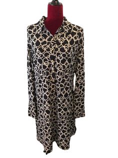 This is a beautiful International Concepts dress. It is Black with white circulars. It has seven gold buttons in front, a turn down collar, long sleeves with two gold buttons on the end of each. This is a lovely knee length dress made of 95% polyester and 5% spandex. The dress is a size XLarge and has a stretch to it. Bust: 42” (has stretch) Waist: 38” (has stretch) Sleeves: 25” Dress Length: 38” Gold Long Sleeve Dress For Work, Long Sleeve Gold Dress For Work, Chic Long Sleeve Midi Dress With Covered Buttons, Elegant Long Sleeve Shirt Dress With Buttons, Elegant Long Sleeve Buttoned Shirt Dress, Chic Gold Long Sleeve Midi Dress, Gold Long-sleeved Dress For Work, Gold Buttons, Knee Length Dress