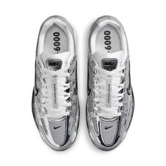 The Nike P-6000 'Metallic Silver' draws inspiration from the 2006 Air Pegasus, infusing it with futuristic flair. Its breathable metallic fabric upper features both vertical and horizontal overlays in chrome synthetic leather, creating a glistening effect. The silver side-panel Nike swoosh is outlined in black embroidery, complementing the black foxing and Nike branding on the tongue tag and heel tab. White laces match the tongue, sock liner, and insole, adorned with P-6000 branding. The comfort Running Aesthetic, P 6000, Vans Top, Clarks Wallabees, Nike Retro, Adidas Campus, Nike Shox, Metallic Fabric, Nike Acg