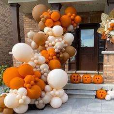 balloons and pumpkins are on the front steps