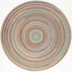 a round rug with an oval design on the center and bottom, in various colors