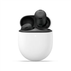 two black and white earbuds sitting in an egg shaped container on a white background