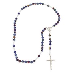 This Murano Glass Rosary Necklace features beautiful blue Millefiori beads and a silver-plated crucifix handcrafted by the skilled master glass-makers in a family-owned workshop on Murano island in Venice, Italy. The rosary necklace is created by hand using ancient glass-making tools and techniques. This is a beautiful religious gift with an Italian flair that will be uniquely appropriate for a special occasion. Measurements: Full Length is 27 inches. The length from the centerpiece to the botto Blue Crucifix Necklace For Spiritual Wear, Blue Crucifix Necklace For Spiritual Purposes, Handmade Blue Crucifix Jewelry, Blue Cross-shaped Jewelry With 8mm Beads, Blue Cross Jewelry With 8mm Beads, Artisan Jewelry Necklaces, Murano Glass Jewelry, Rosary Necklace, Handcrafted Artisan Jewelry