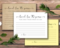 wedding advice cards with greenery on wooden background