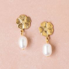 "A sweet pair of small golden brass flower studs with 5mm freshwater pearls. The earrings measure 1\" long from the top of the flower to the bottom of the pearl. The details: 10mm brass flowers 5mm freshwater pearl 24K gold-plated posts Handmade in our Burlington VT studio. shipped in a gift box." Brass Flowers, Earrings For Wedding, Gold Chain Earrings, Burlington Vt, Golden Earrings, Long Chain Necklace, Earrings Pearl, Genuine Turquoise, Leaf Necklace