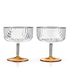 two glass goblets sitting on top of each other