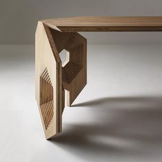 a wooden table with an open door on the top and bottom section that is shaped like a hexagonal structure