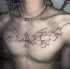 a man with a tattoo on his chest