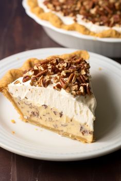 a slice of pecan pie on a plate next to the rest of the pie