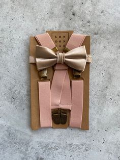 Dusty rose elastic suspenders and champagne silk bow tie set. Perfect for weddings, groomsmen, family photos, or just because! "SET" options are the only options that include BOTH a bow tie and suspender.   Bow Ties, Neck Ties, Suspenders and Pocket Squares can be purchased individually from the link below CHAMPAGNE BOW TIES, NECK TIES AND POCKET SQUARES LISTING LINK https://www.etsy.com/LondonJaeApparel/listing/1192495128/champagne-satin-bow-ties-for-men-wedding?utm_source=Copy&utm_medium=Listi Fitted Belts And Suspenders With Bow For Party, Elegant Suspenders For Party Suit Accessories, Elegant Fitted Belts And Suspenders With Bow, Elegant Party Belt With Bow, Elegant Adjustable Belts And Suspenders For Wedding, Adjustable Ribbon Bow Tie For Wedding, Adjustable Pink Bow For Wedding, Elegant Adjustable Belts And Suspenders For Black Tie, Elegant Belts And Suspenders As Gift