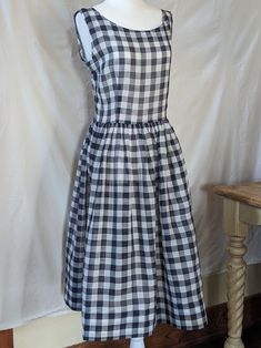 This sleeveless cotton gauze day dress is a staple for any vintage fashionista! Unlined, semi sheer fabric, can be worn with or without a slip, depending on your inclination, fitted bodice, defined waist, gathered skirt, side zipper closure.  There are no flaws aside from a few very faint rust colored spots on the skirt, I only noticed them when I ironed the dress. See pictures.  Measurements taken flat: Waist: 14 ½" Bust: 18½" Hips: Free Shoulder to waist: 16" Skirt length: 26" Cotton Gauze Dress, Defined Waist, Johnson City, Gauze Dress, Gathered Skirt, Sheer Fabric, Semi Transparent, Rust Color, Day Dress