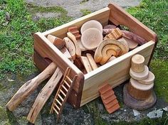 a wooden box filled with lots of different types of woodworking tools on top of a grass covered field