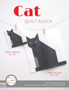 the cat quilt block is made from black paper and has two green eyes on it