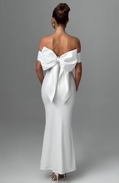 Introducing the dreamiest dress to say 'I do' in. Joanna is cut from our luxe stretch crepe that hugs the figure and flares gently at the skirt. It has a pleated satin bardot panel neckline with stunning removable bow to the reverse. It's complete with pleats to the waist. 



Colour: Ivory.

Premium stretch crepe fabric.

Fully lined.

Pleated satin bardot panel on neckline.

Removable satin bow on reverse.

Asymmetric pleats on waist.

Fit and flare skirt.

Invisible zipper to the reverse.

Ma Homecoming Dresses Corset, White Dress Spring, Midi Dress Wedding Guest, Split Long Dress, Bow Wedding Dress, Engagement Dress, Loungewear Dresses, Fit And Flare Skirt, Maxi Dress Sale