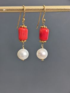 "Freshwater Pearl Coral Earrings, White Pearl Red Coral 24 K Gold Filled Long Earrings, January and June Birthstone. Approximately  1 3/4\" ( 45 mm. )long. Thank you for visiting GlamorousJewelry1 *Please add this store as your favorite and visit again! https://www.etsy.com/shop/GlamorousJewelry1?ref=hdr_shop_menu * Processing time is 3-5 days.  * US orders are shipped first class mail. * International orders are shipped first class international. * Shipping upgrades are available at checkout. Thank you for visiting my listing!" Coral Earrings, June Birthstone, Gift For Mother, Earrings White, June Birth Stone, Red Coral, White Pearl, Long Earrings, Pearl White