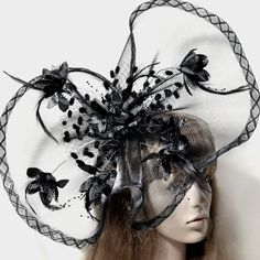 Elegance Meets Sophistication In This Striking Fascinator. With Its Bold Black Hue And Large Size, This Headpiece Exudes A Sense Of Grandeur And Style. Perfect For Tea Parties, Races, Soires, Church Events, Memorials, And Funerals, This Fascinator Is A Versatile Accessory That Adds A Touch Of Glamour To Any Ensemble. Its Intricate Design And Attention To Detail Make It A Truly Gorgeous Piece That Is Sure To Turn Heads And Leave A Lasting Impression. Whether You're Attending A Formal Event Or Loo Fascinator Hair, Bohemian Party, Black Fascinator, Hat Party, Large Feathers, Satin Dress Long, Flower Hat, Church Events, Wedding Fascinators