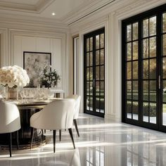 an elegant dining room with large windows and marble flooring