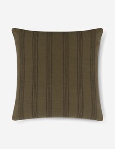 a brown and black striped pillow on a white background