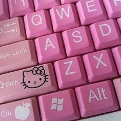 pink keyboard with hello kitty sticker on it's keys and the words qwert asd zx