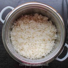 the rice is being cooked in the pot