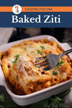 baked ziti in a casserole dish with a fork