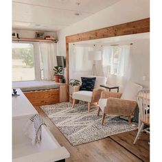 a living room filled with furniture and a baby crib