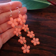 Orange Beaded Flower-shaped Jewelry, Orange Beaded Flower Jewelry, Orange Flower-shaped Beaded Jewelry, Orange Flower-shaped Jewelry For Beach, Orange Flower Jewelry For Beach, Orange Flower-shaped Beach Jewelry, Orange Beach Jewelry With Dangling Beads, Orange Jewelry With Dangling Beads For Beach, Adjustable Orange Tiny Beads Earrings